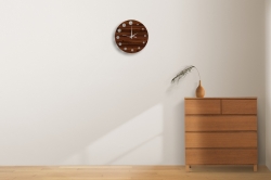 Dark Brown Wall Click With Circle Design In Border Which Indicates Numerals